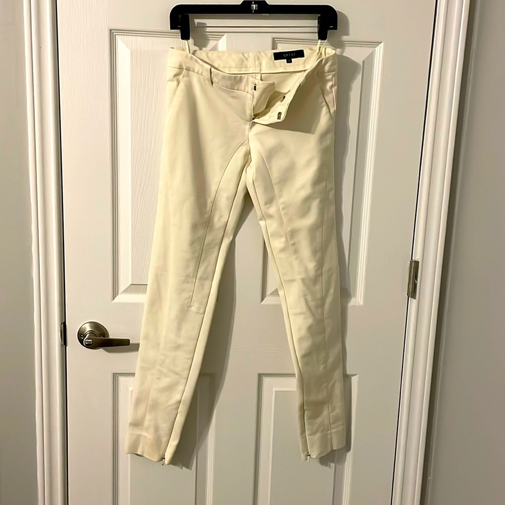 Gucci cream colored evening pants with gold signa
